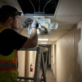 Emergency lighting maintenance in a commercial corridor